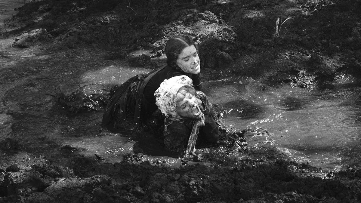 Melissa Gilbert fighting Alison Arngrim in character in a pool