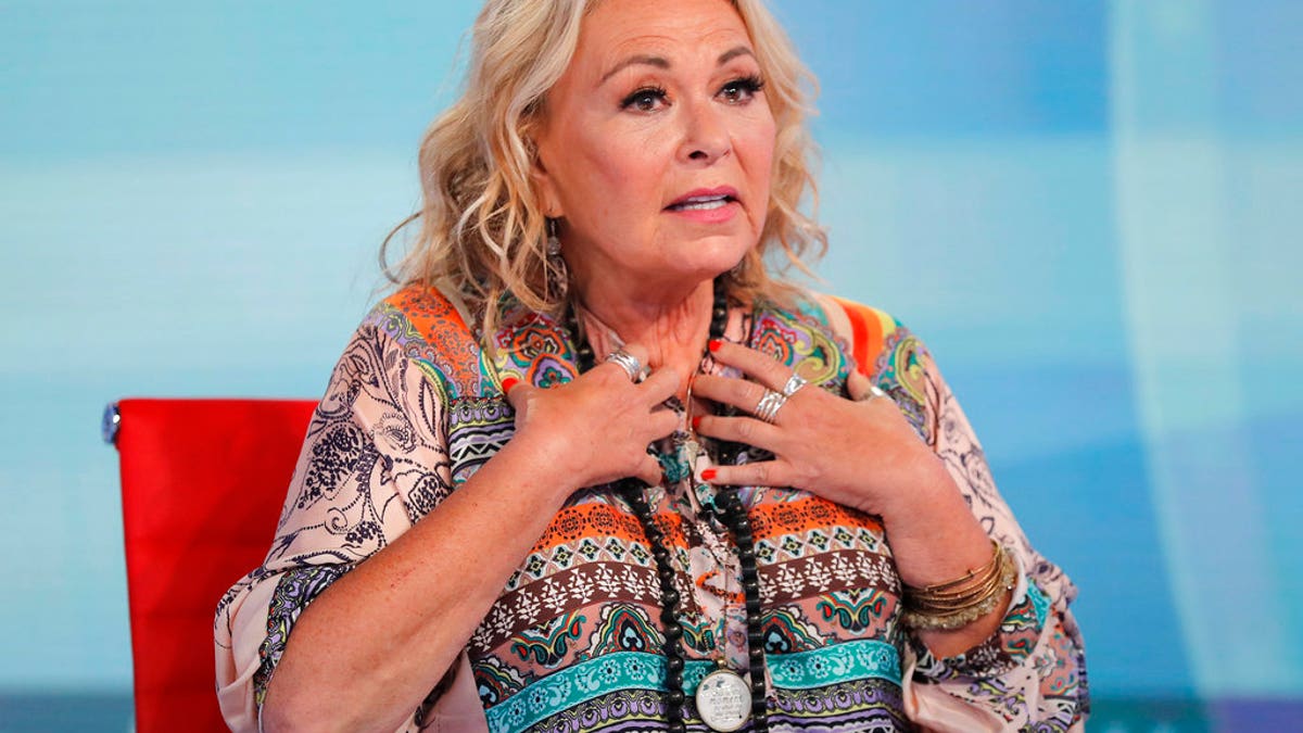 Roseanne Barr talks with Fox News talk show host Sean Hannity while being interviewed during a taping of his show, Thursday, July 26, 2018, in New York. The comedian and actress will appear on the Fox News show "Hannity" on Thursday at 9 p.m. EDT for the first time since she was fired from ABC which canceled its successful reboot of "Roseanne" in May following the star's racist tweet likening former Obama adviser Valerie Jarrett to a cross between the Muslim Brotherhood and a "Planet of the Apes" actor. (AP Photo/Julie Jacobson)