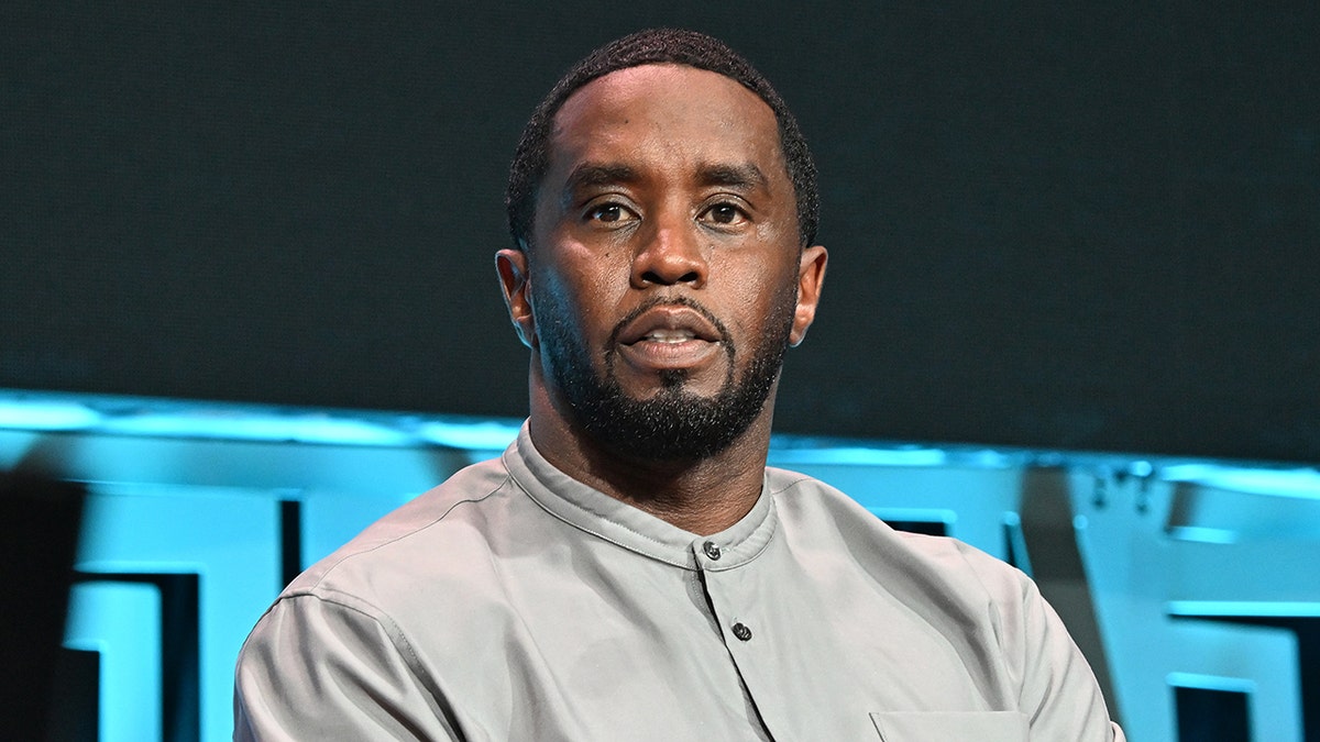Diddy stares into the camera