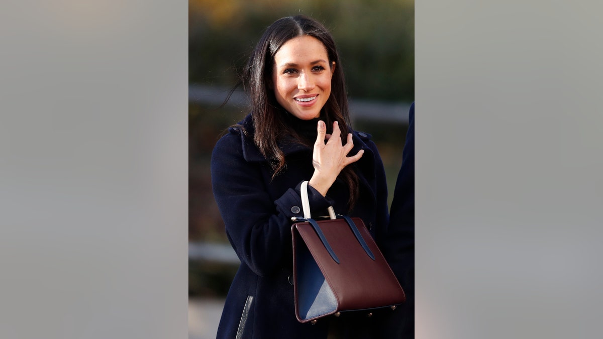 Britain's Prince Harry's fiancee Meghan Markle arrives at Nottingham Academy in Nottingham, England , Friday, Dec. 1, 2017. It was announced on Monday that Prince Harry and American actress Meghan Markle are engaged and will marry in the spring of 2018. (AP Photo/Frank Augstein)