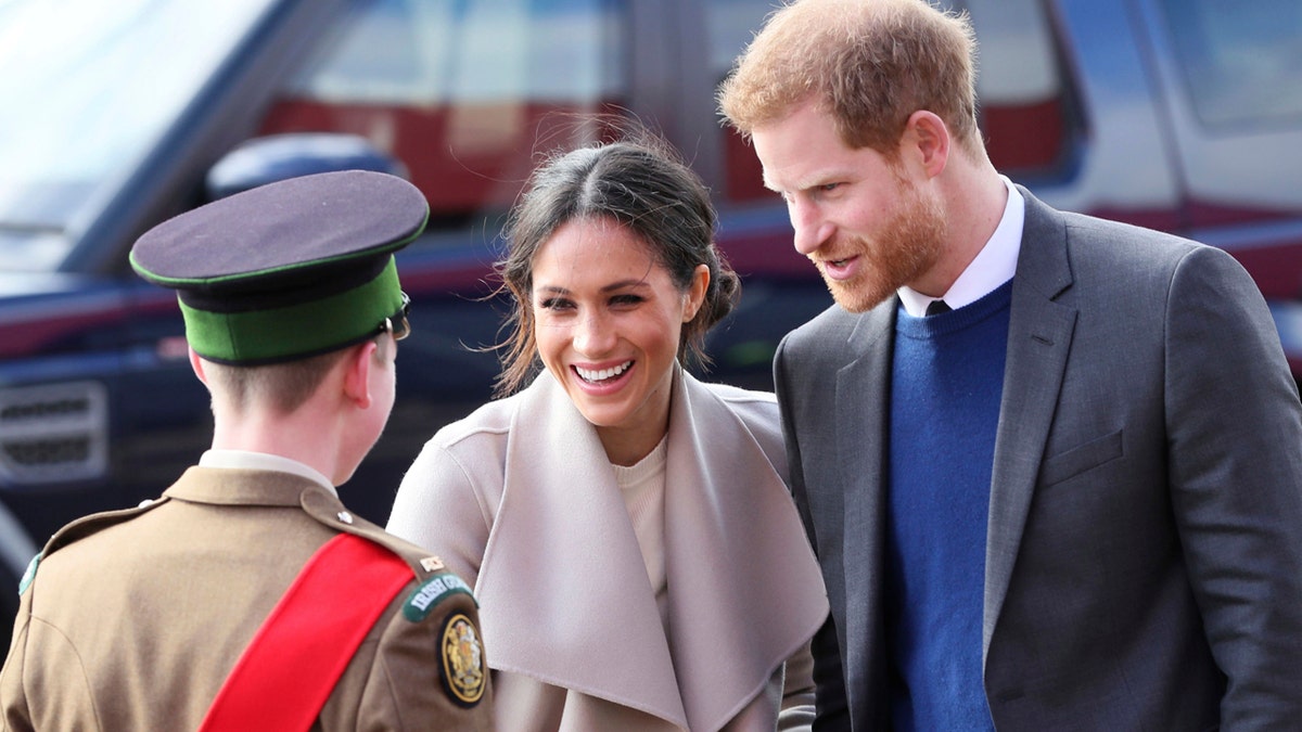 Britain's Prince Harry and Meghan Markle arrive for a visit to the Eikon Exhibition Centre in Lisburn, Northern Ireland where they attended an event to mark the second year of youth-led peace-building initiative Amazing the Space Friday March 23, 2018. Prince Harry and Meghan will get married at St. George's Chapel in Windsor Castle on Saturday May 19. (Brian Lawless/PA via AP)