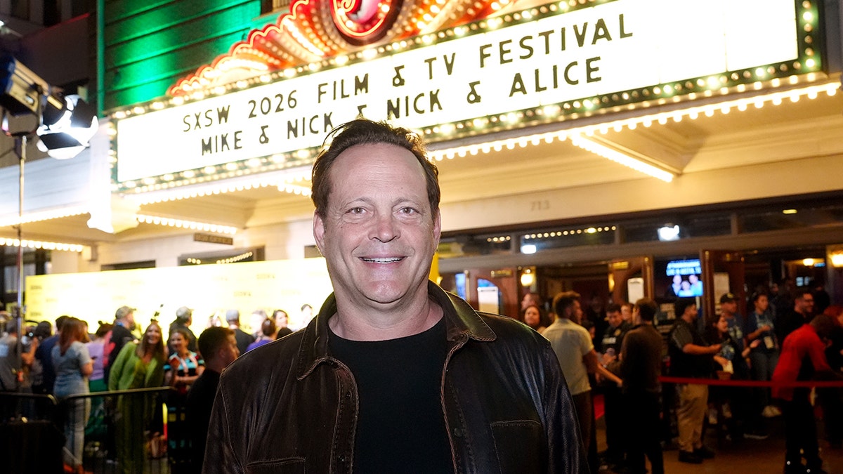 Vince Vaughn standing in front of marquee for his new movie
