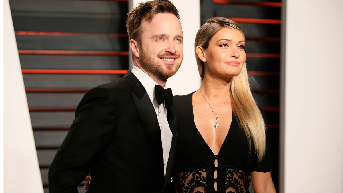 Actor Aaron Paul and his wife Lauren Parsekian arrive at the Vanity Fair Oscar Party in Beverly Hills, California February 28, 2016. REUTERS/Danny Moloshok - TB3EC2T0N4FJ2