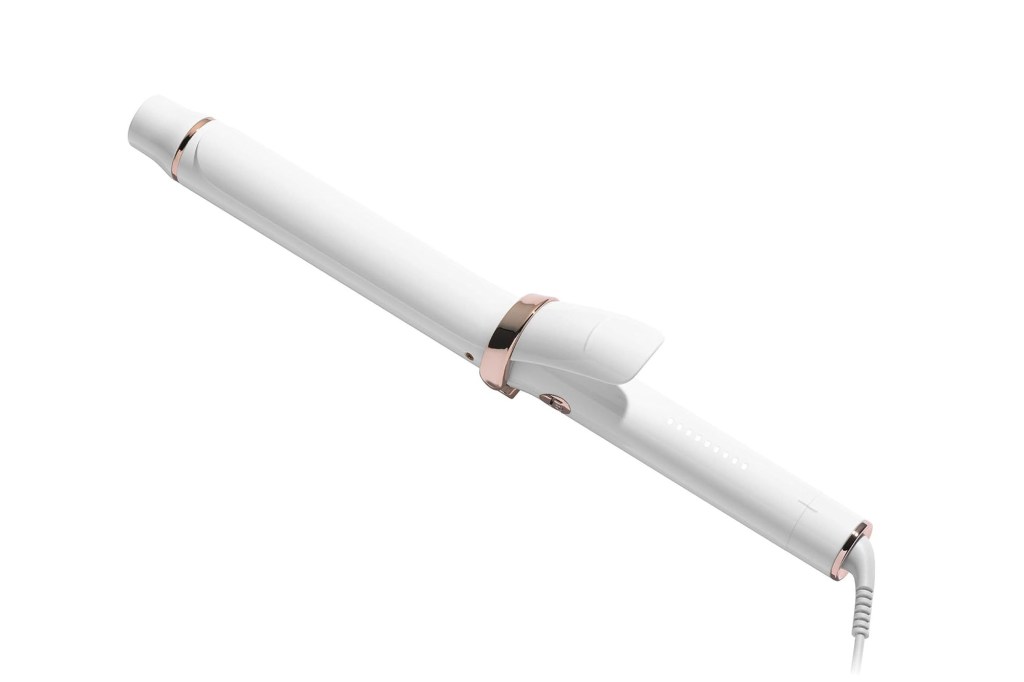 White curling iron with rose gold accents.