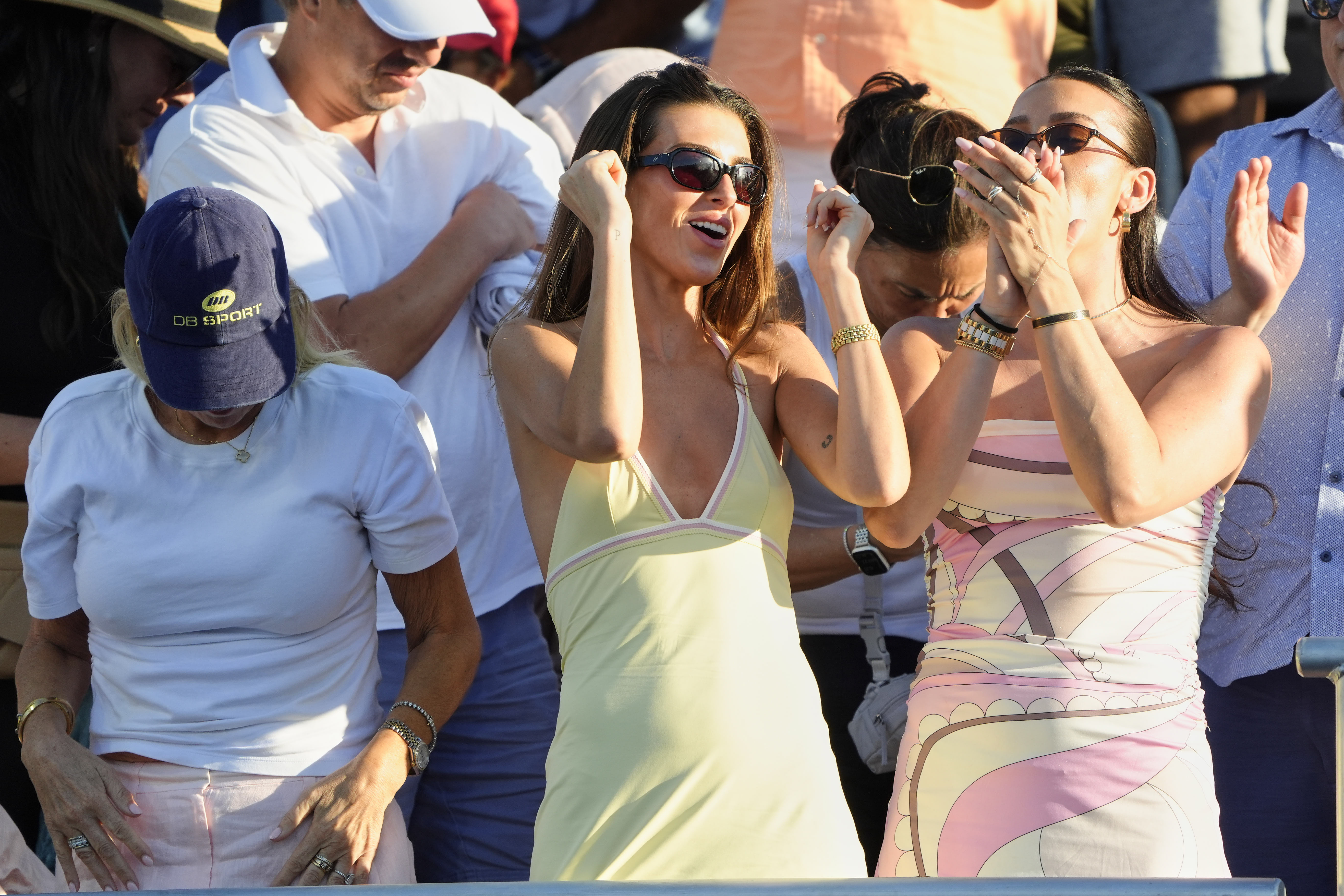 Influencer Paige Lorenze  cheers for her fiancé, tennis player Tommy Paul, at the Miami Open.