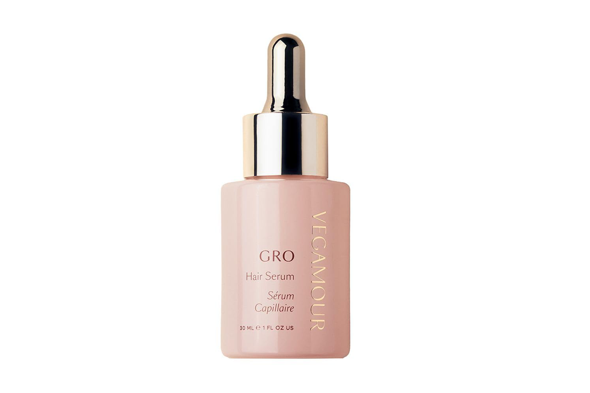 Vegamour GRO Hair Serum in a light pink bottle with gold lettering and dropper top.