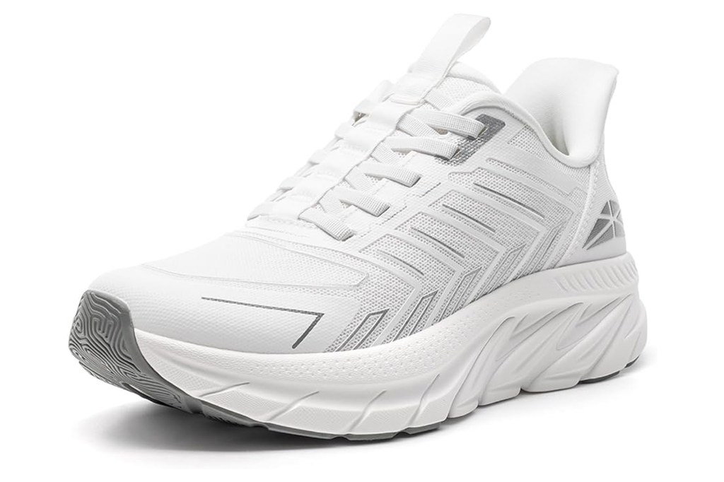 A white athletic shoe with a thick sole and grey accents.