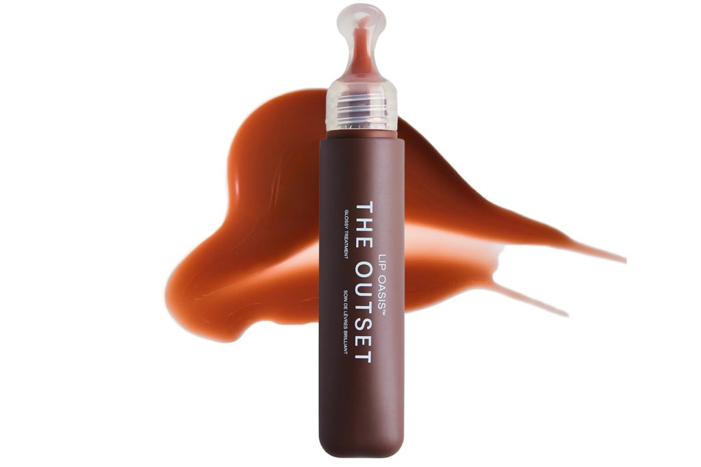 The Outset Lip Oasis Glossy Treatment with a smear of product.