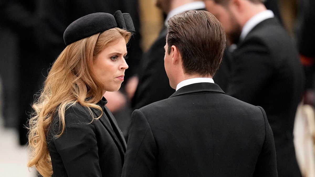 Princess Beatrice looks to her husband Edward Mapelli during Queen Elizabeth's state funeral