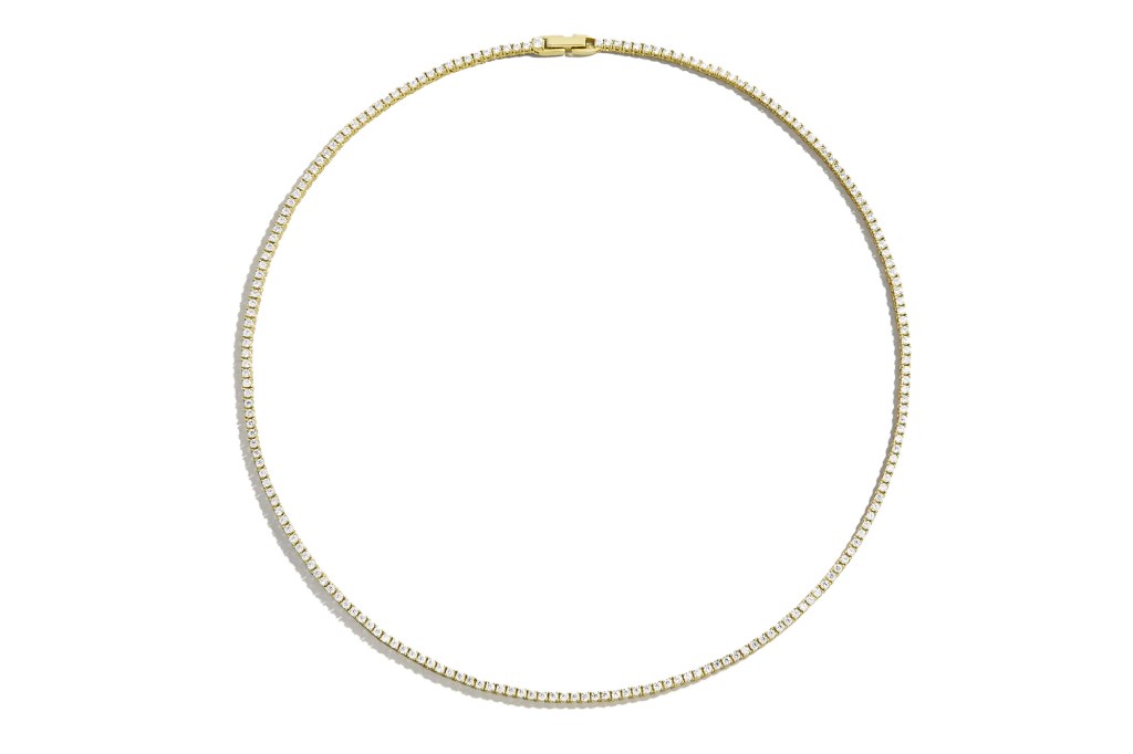 Gold necklace with a tennis chain of diamonds.