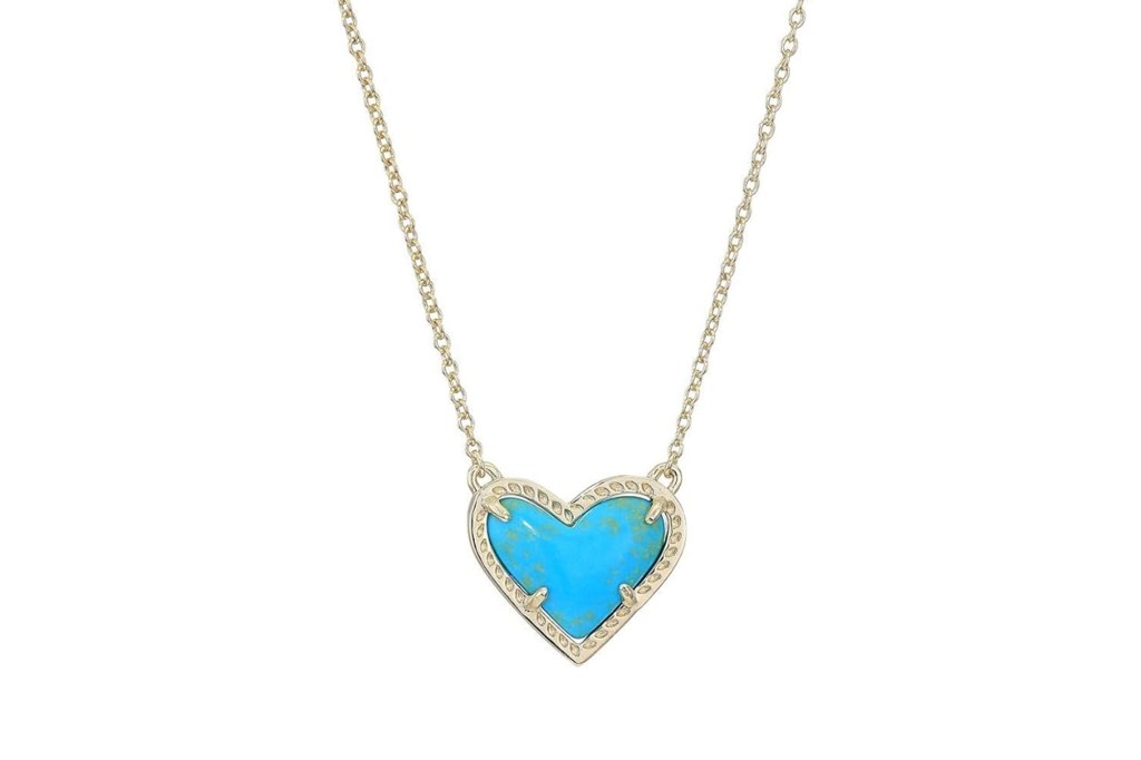 Gold chain necklace with a turquoise heart pendant.