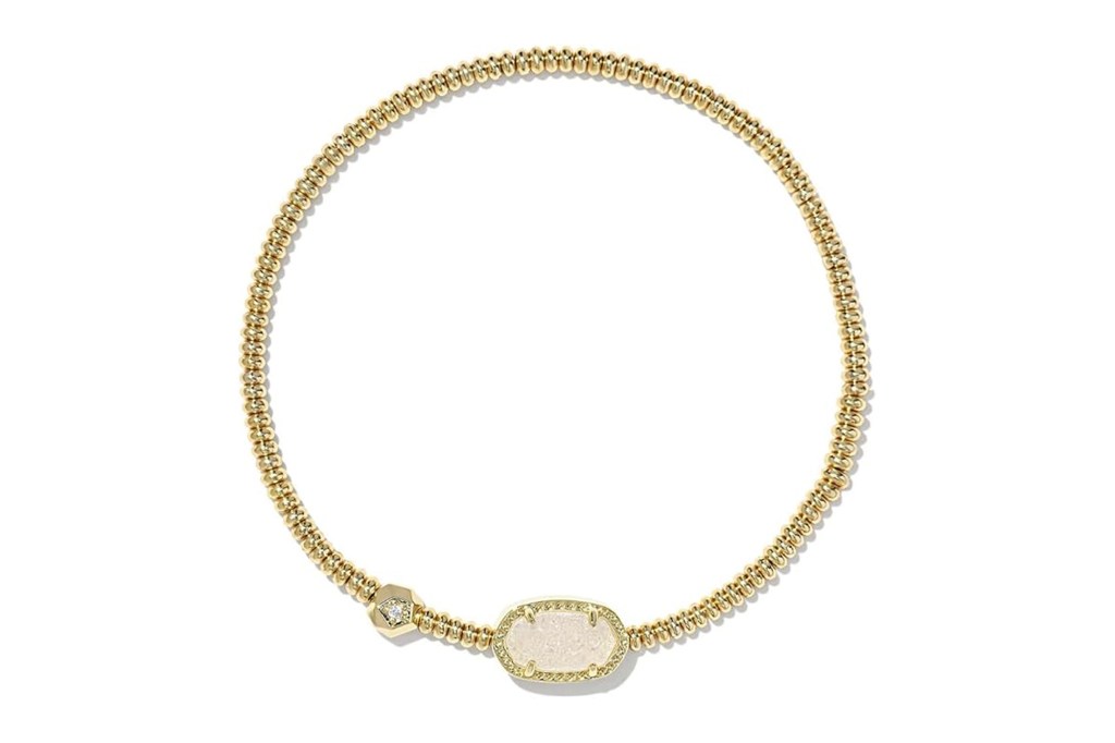 Gold bracelet with white stone oval setting and small diamond hexagon.