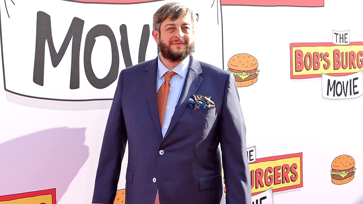 Eugene Mirman smiling at the Los Angeles premiere of "The Bob's Burgers Movie" in May 2022.