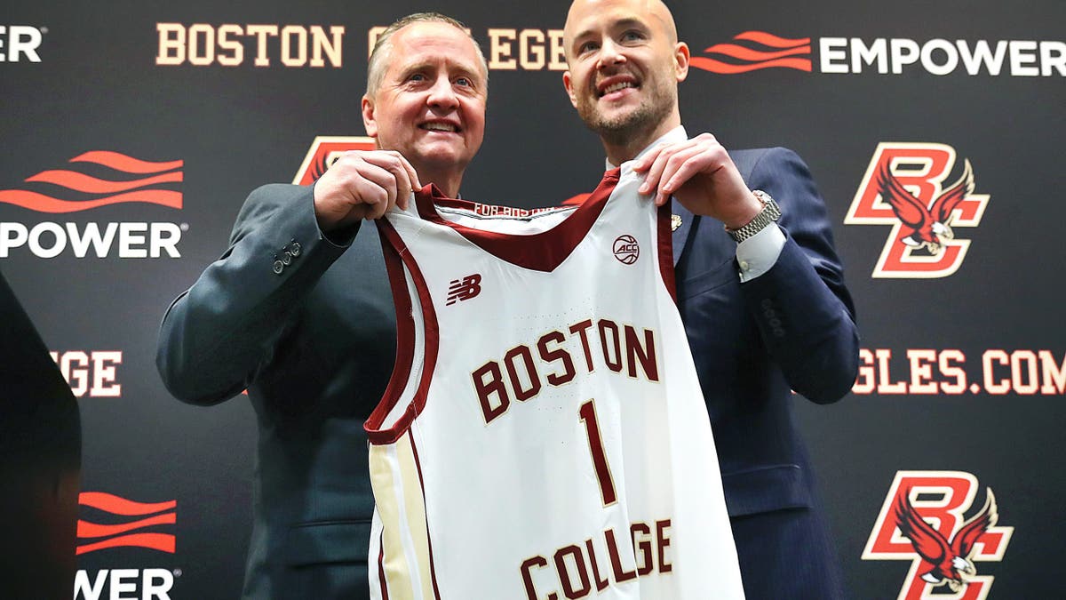 Boston College Director of Athletics Blake James and men's basketball head coach Luke Murray posing together