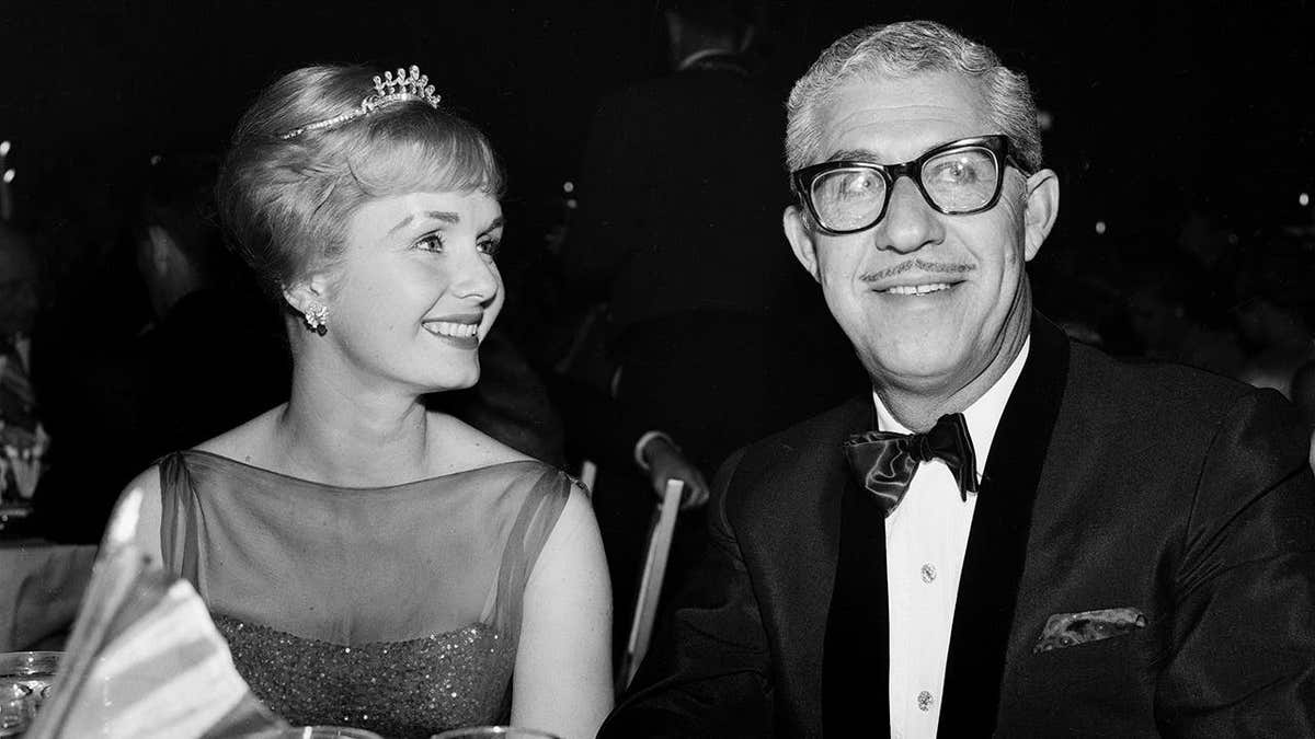 Actress Debbie Reynolds standing with Harry Karl at an event in Los Angeles