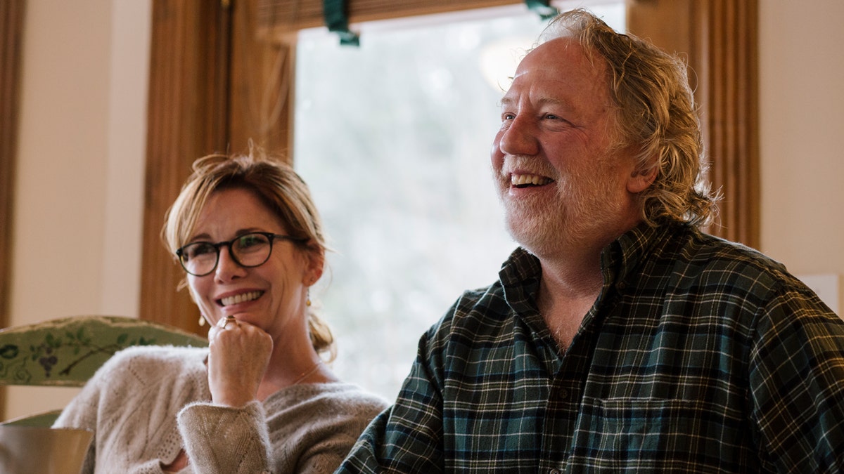 Melissa Gilbert sitting with husband Timothy Busfield inside their home in Brighton Michigan