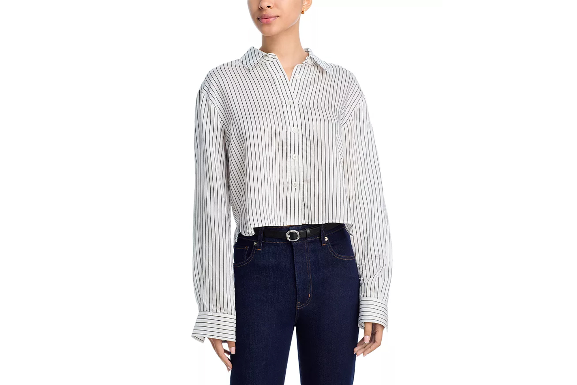 A cropped white button-down shirt with black vertical stripes, paired with high-waisted dark blue jeans and a black belt.