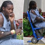 Offset smokes cigarette outside hospital after being shot in the leg