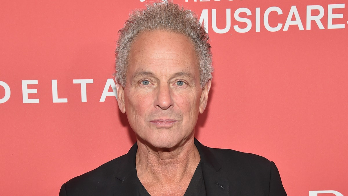 Lindsey Buckingham standing on the red carpet at Radio City Music Hall