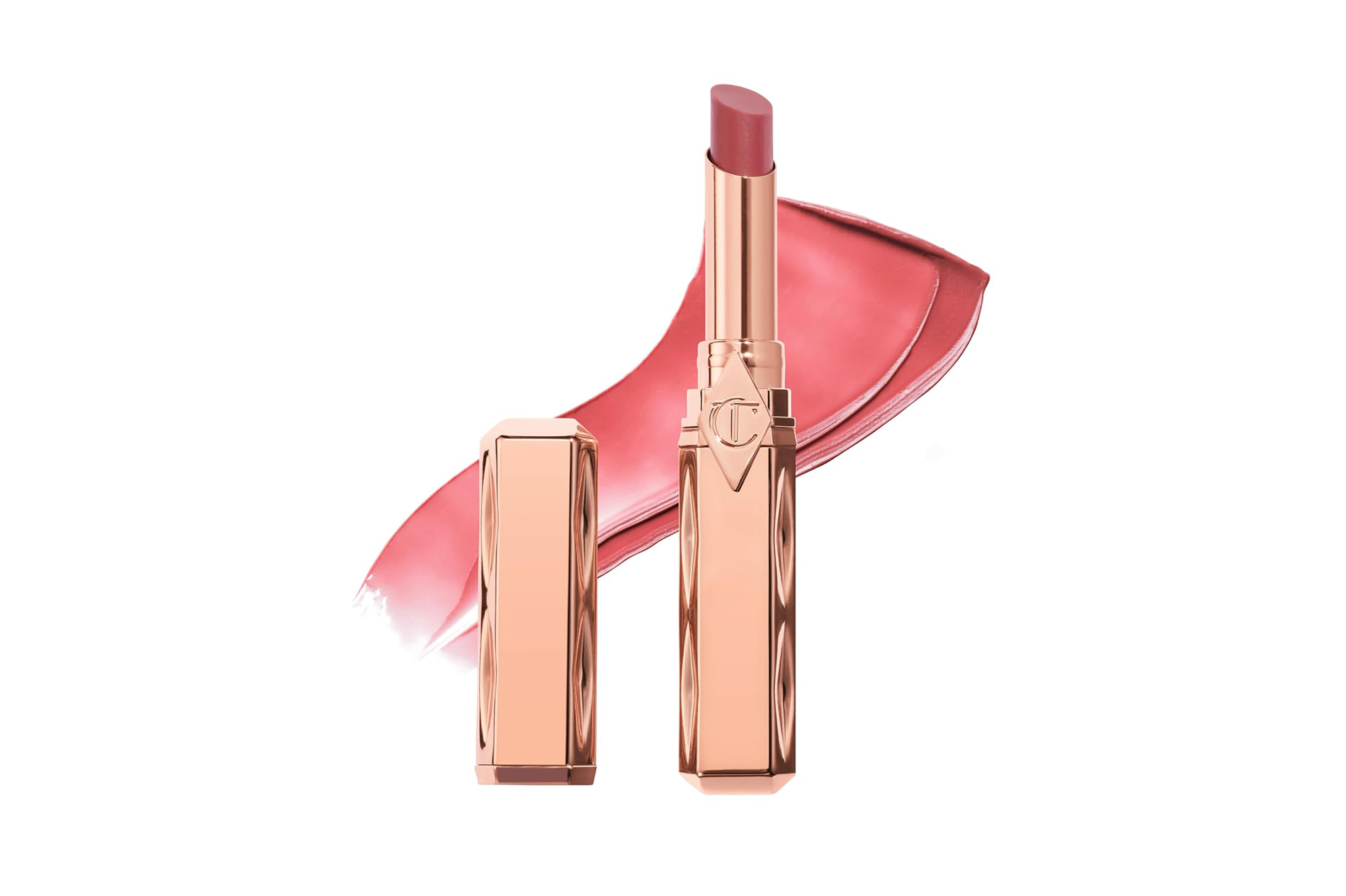 A rose gold lipstick with its cap next to a swatch of pink-rose lipstick.
