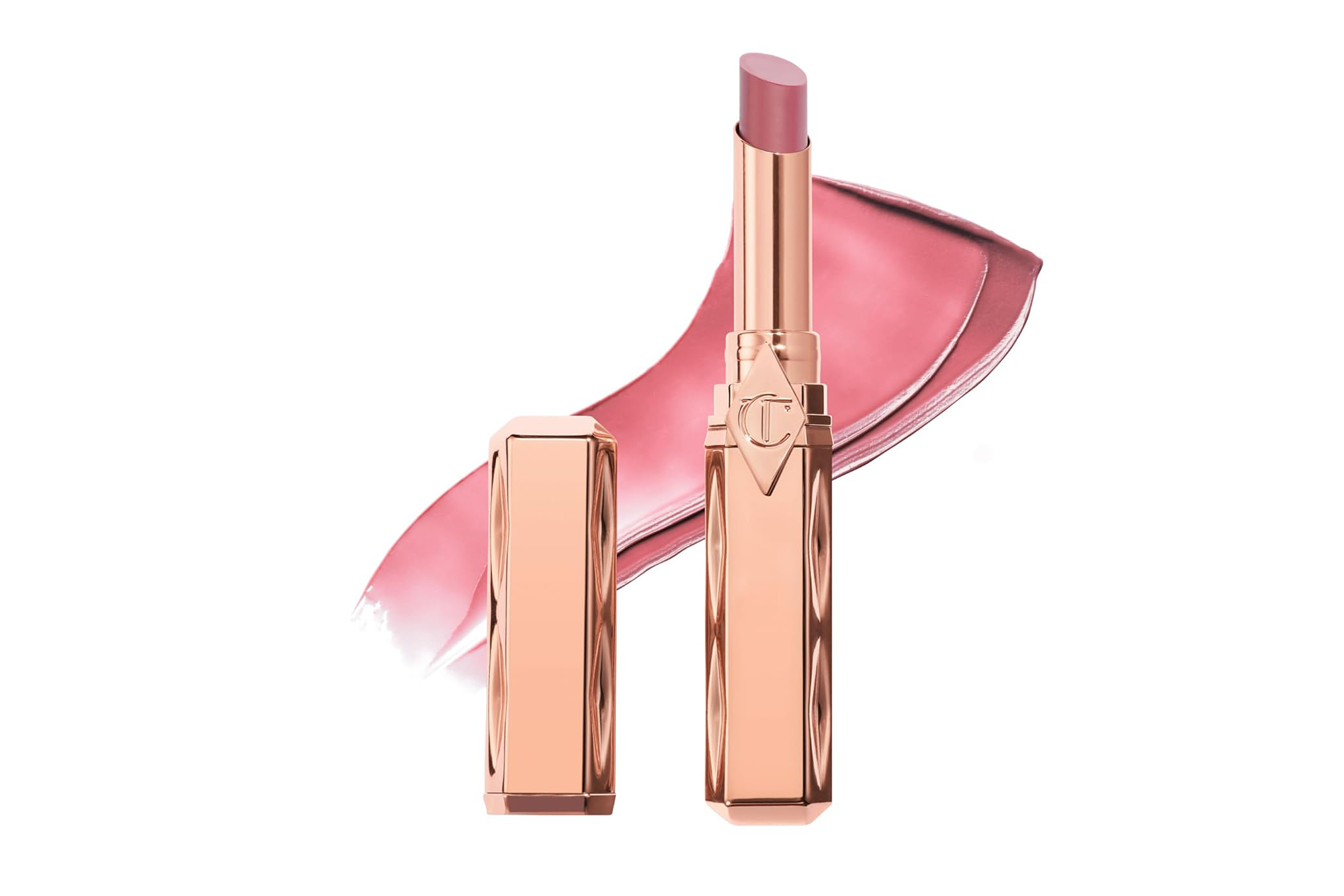 Rose gold lipstick tube with the cap off, revealing a light pink balm, with a swatch of the balm behind it.