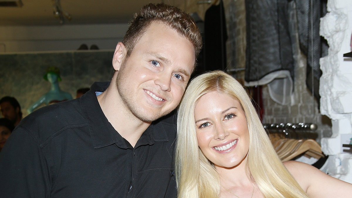 Spencer Pratt and Heidi Montag posing together at an event.