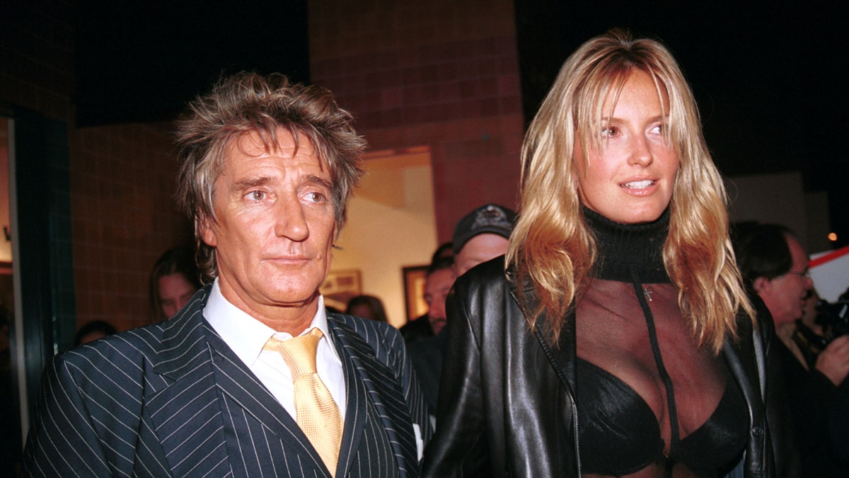 Musician Rod Stewart and girlfriend Penny Lancaster attending gallery opening in Beverly Hills