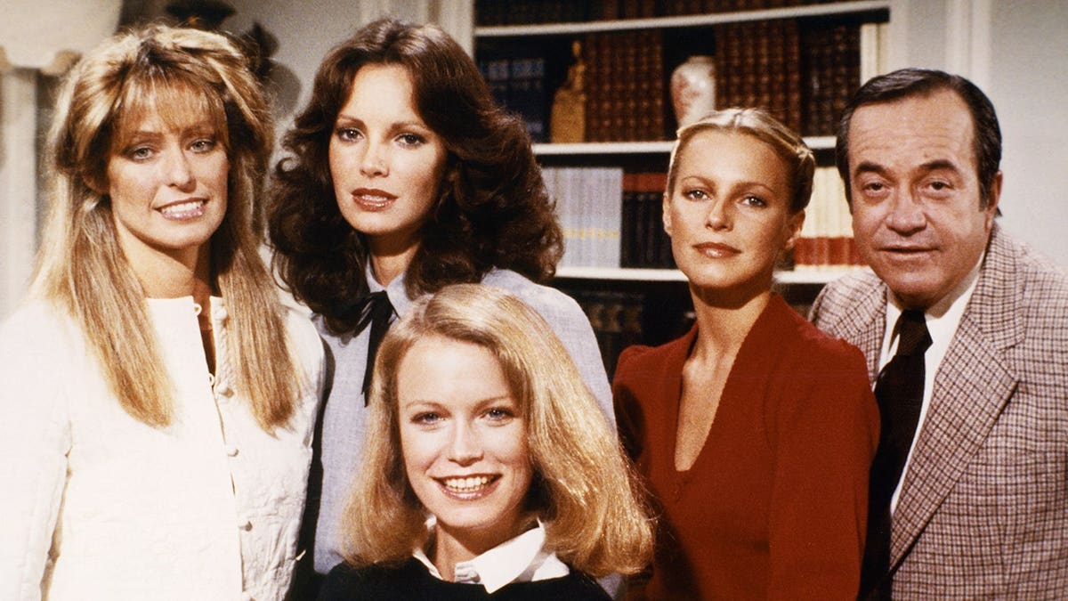 Farrah Fawcett, Jaclyn Smith, Shelley Hack, Cheryl Ladd, and David Doyle posing on the set of Charlies Angels