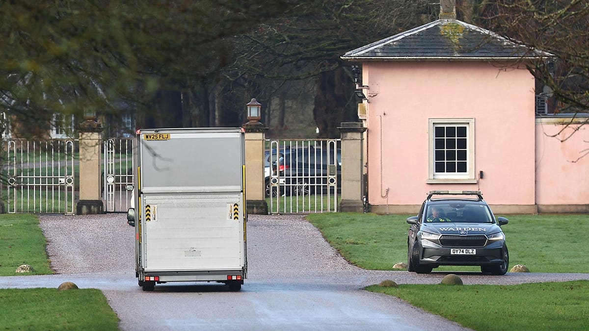 A removals van arriving at the entrance to the Royal Lodge in Windsor Great Park