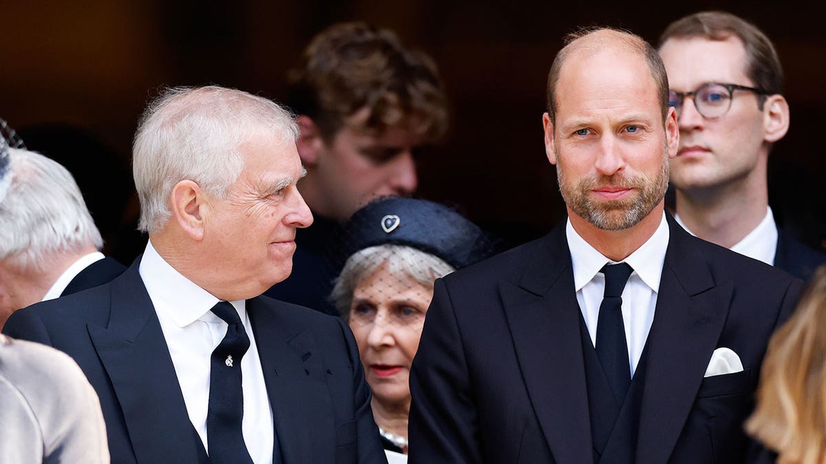 Prince Andrew and Prince William attending a requiem mass at Westminster Cathedral in London