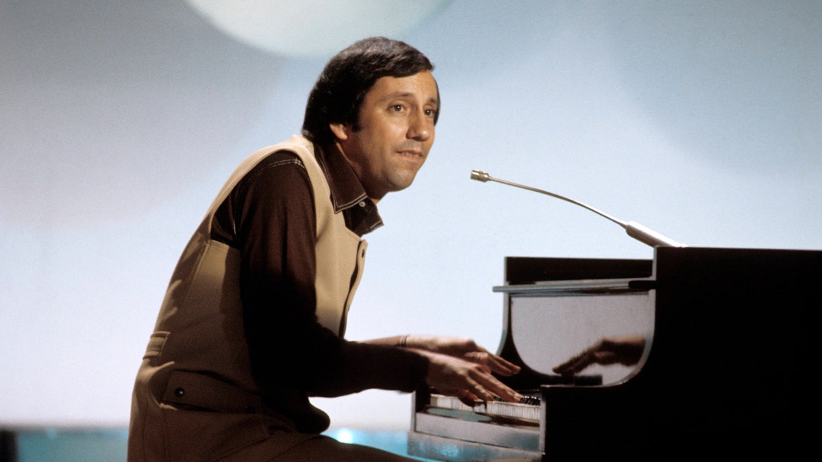 Young Ray Stevens playing the piano