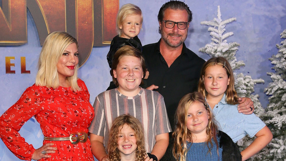 US actress Tori Spelling and husband actor Dean McDermott arrive with children at TCL Chinese Theatre