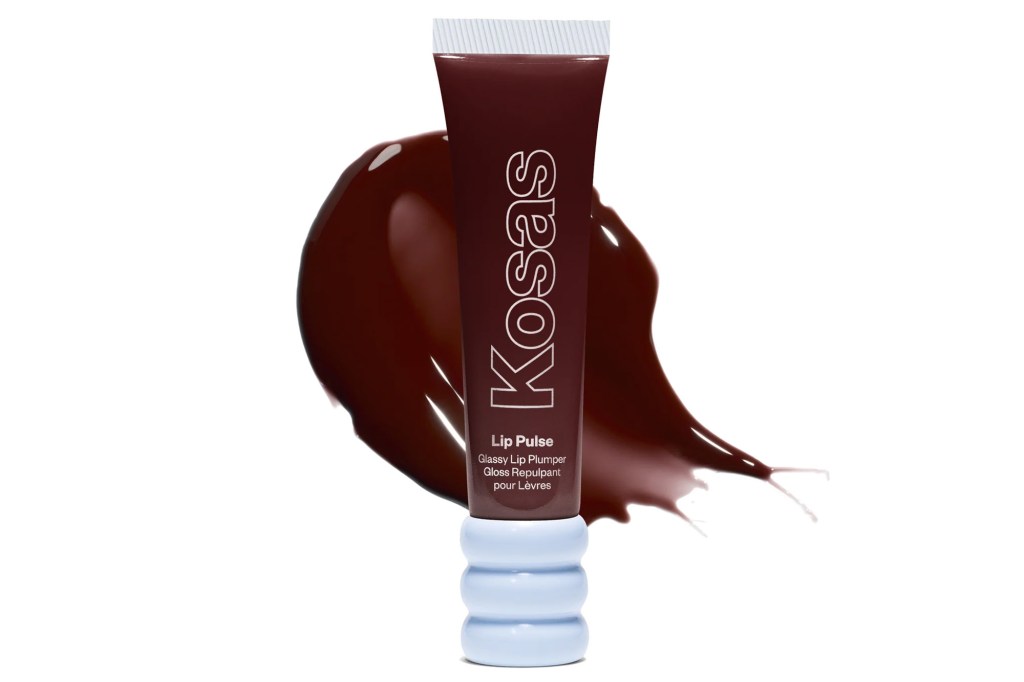 A tube of Kosas Lip Pulse Glossy Lip Plumper in a dark berry shade, with a swirl of the same color behind it.