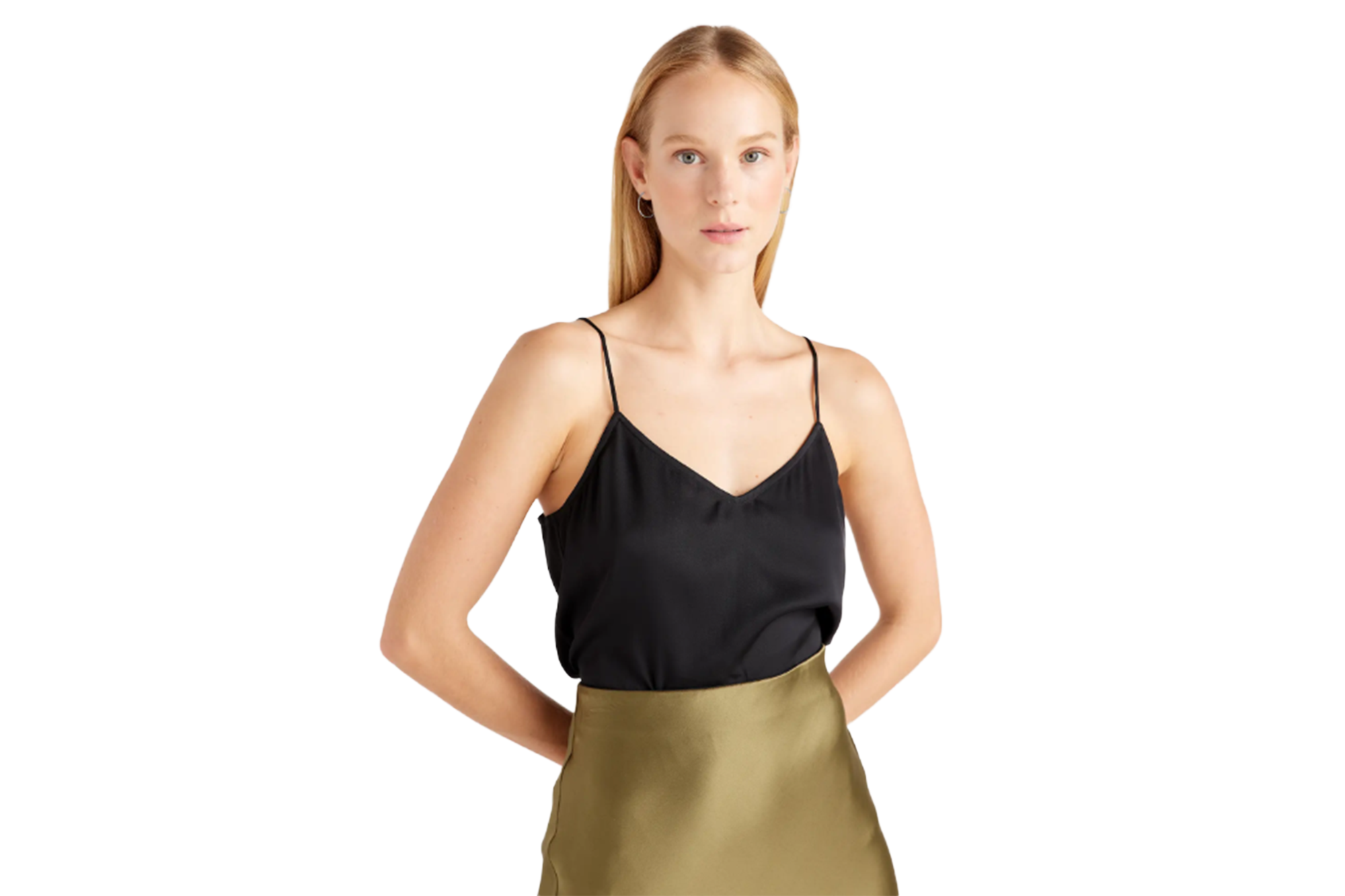 Woman wearing a black camisole and an olive green skirt.