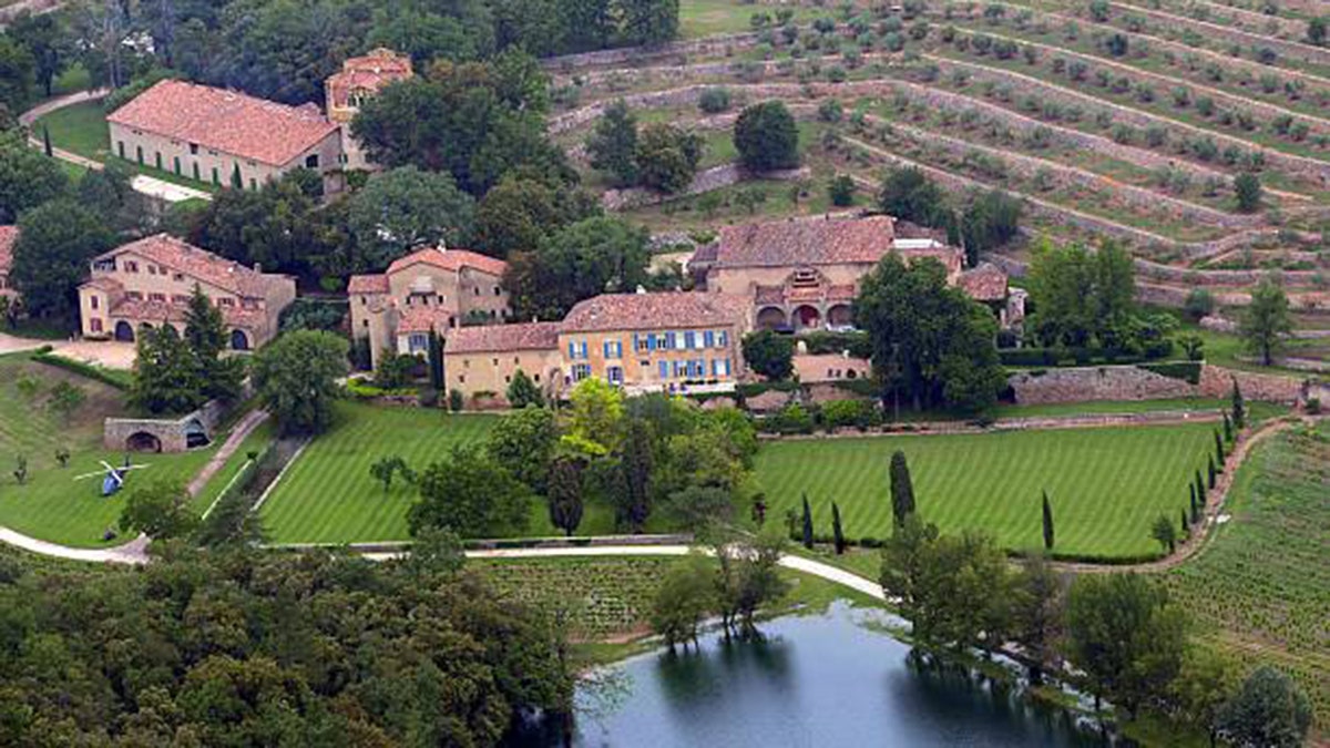 Brad Pitt standing outside Château Miraval winery estate