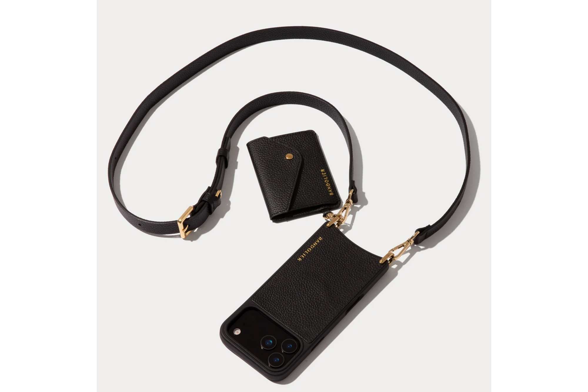 Black Bandolier iPhone case with a black strap and attached mini pouch.