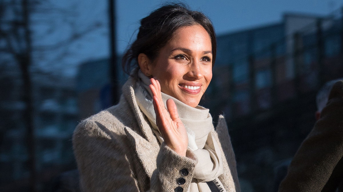 Meghan Markle waving while leaving Reprezent 107.3FM community radio station in Brixton