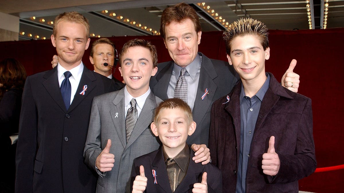 Actors Christopher Masterson, Frankie Muniz, Erik Per Sullivan, Bryan Cranston and Justin Berfield giving thumbs up at Emmy Awards