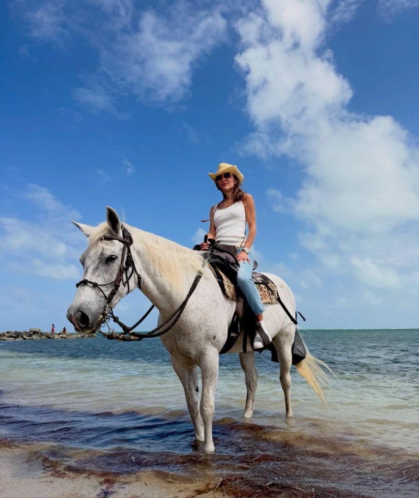 Former “Real Housewife” Bethenny Frankel reins over a beach on a horseback-riding tour.