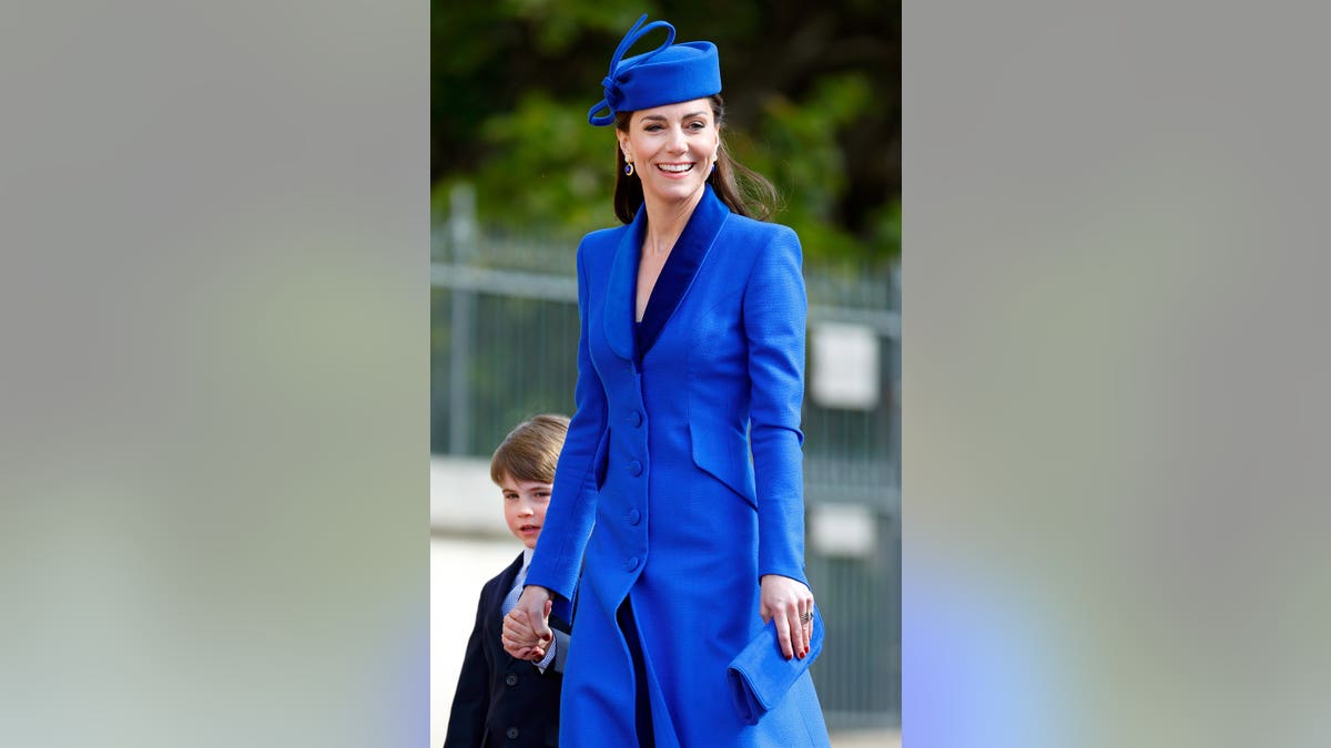 Prince Louis of Wales and Catherine, Princess of Wales, standing inside St George's Chapel at Windsor Castle