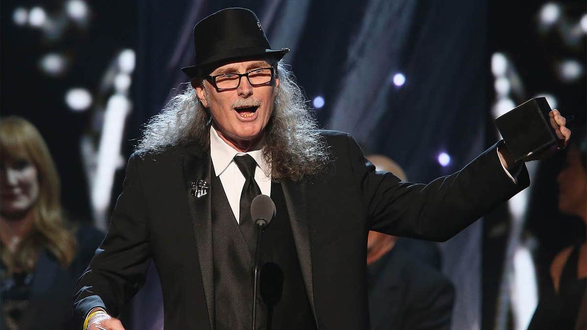 Vini Lopez speaking onstage at the Rock and Roll Hall of Fame induction ceremony in New York City
