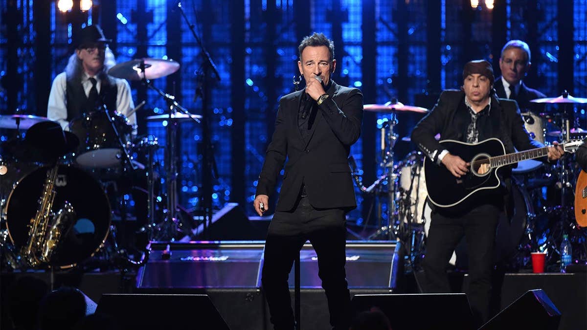 Bruce Springsteen performing onstage with Vini Lopez, Steve Van Zandt, and Max Weinberg in New York City