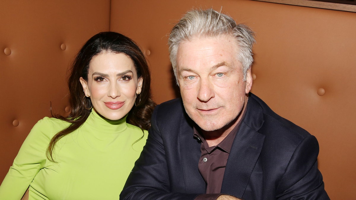 Hilaria Baldwin and Alec Baldwin posing together at Planet Hollywood in New York City