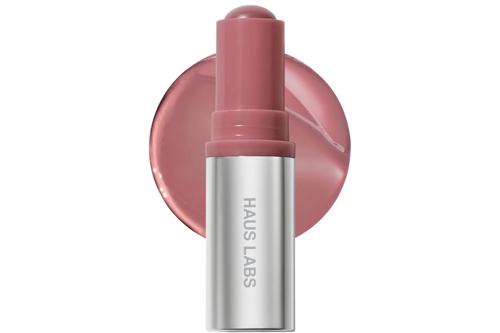 Haus Labs lip crayon in rose color, with a smear of the product behind it.