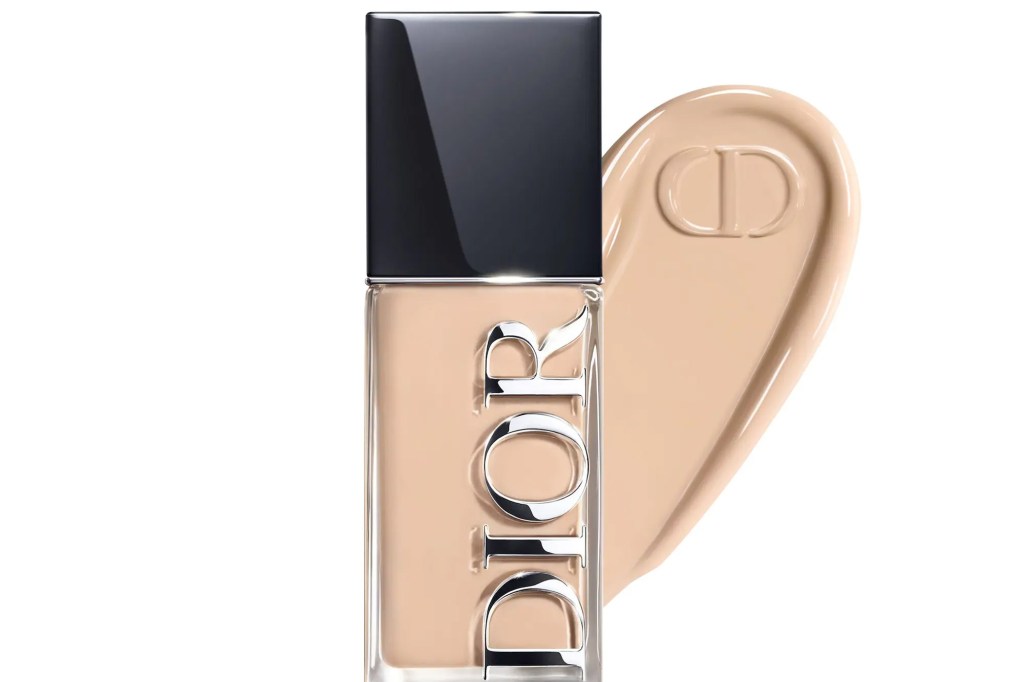 Dior foundation bottle next to a swipe of the product with the "CD" logo impressed in it.