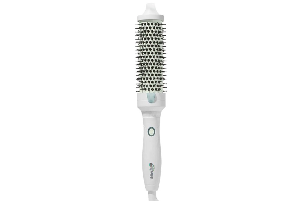 Mane hair dryer brush with a green button and "Mane" written on its handle.