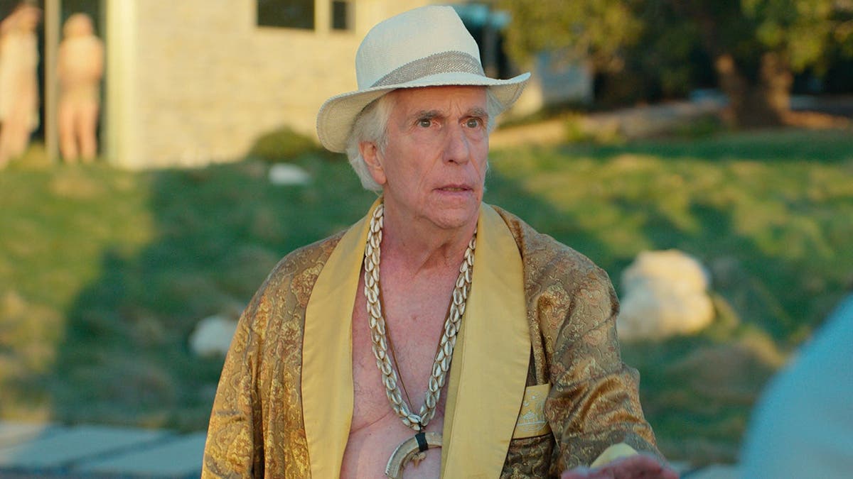 Henry Winkler in a robe in a scene for season three of 