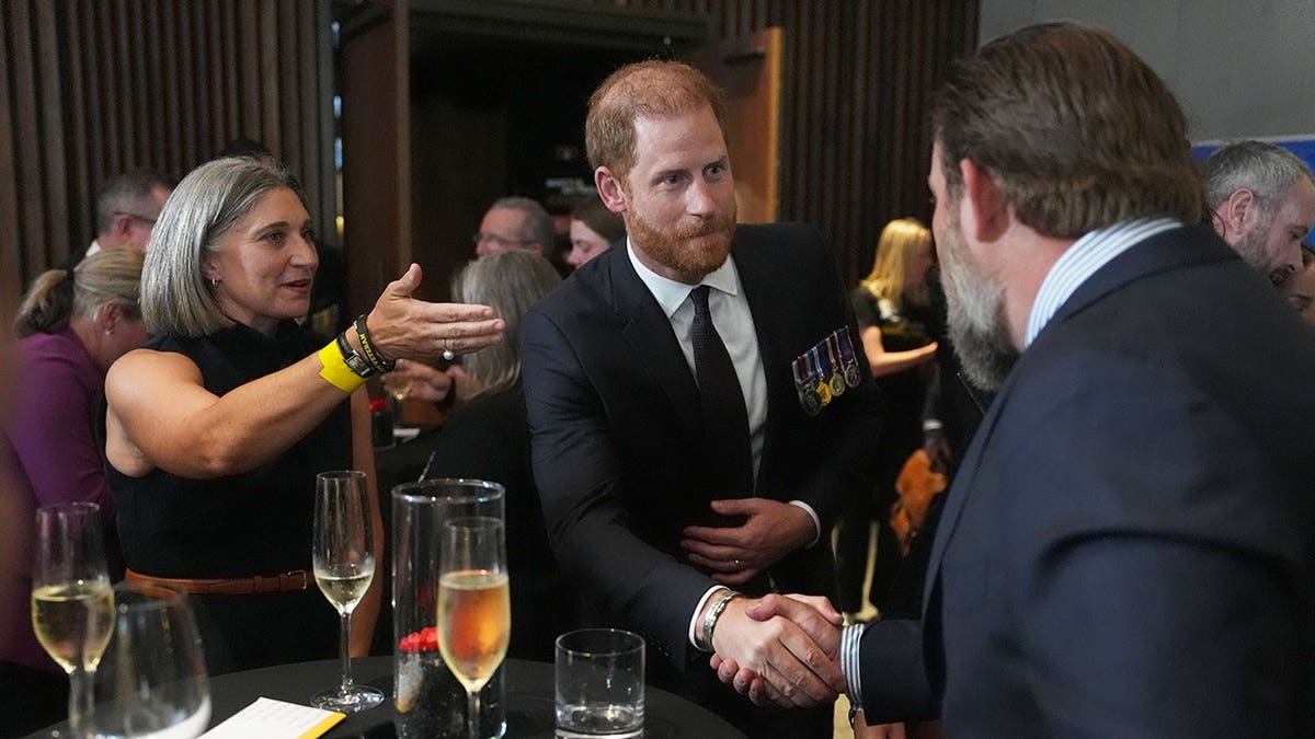 Prince Harry meeting guests during the Invictus Australia Reception at the Australian War Memorial in Canberra