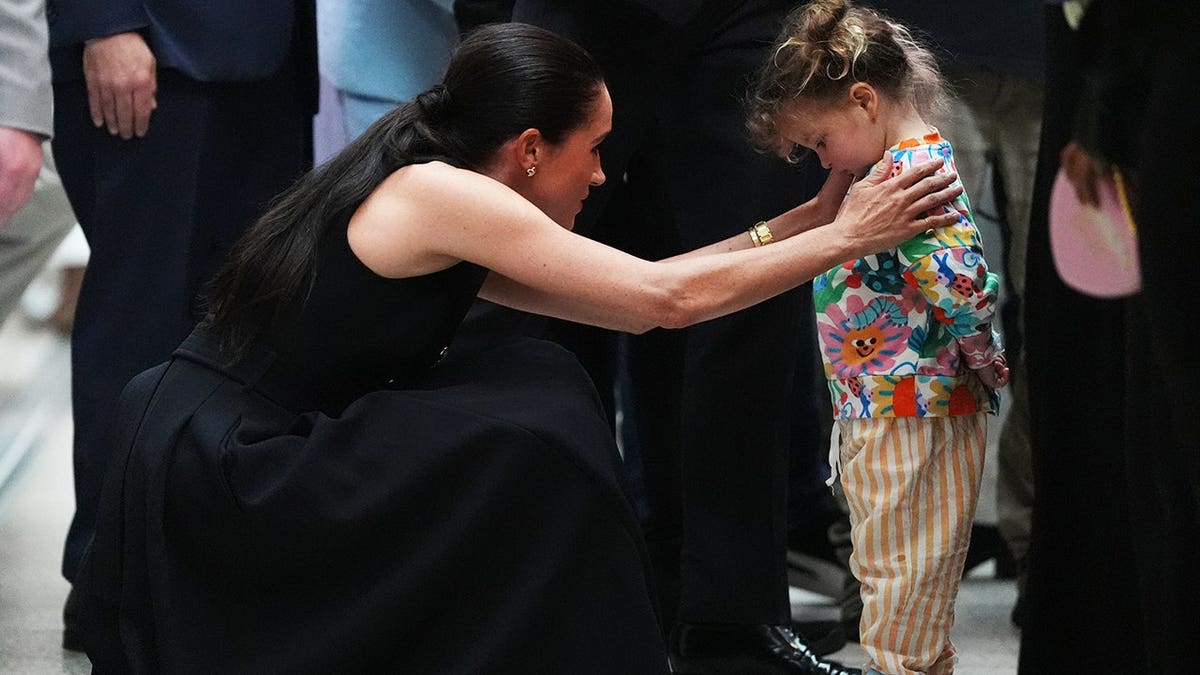 Meghan Duchess of Sussex meeting a young patient at Royal Children's Hospital in Melbourne
