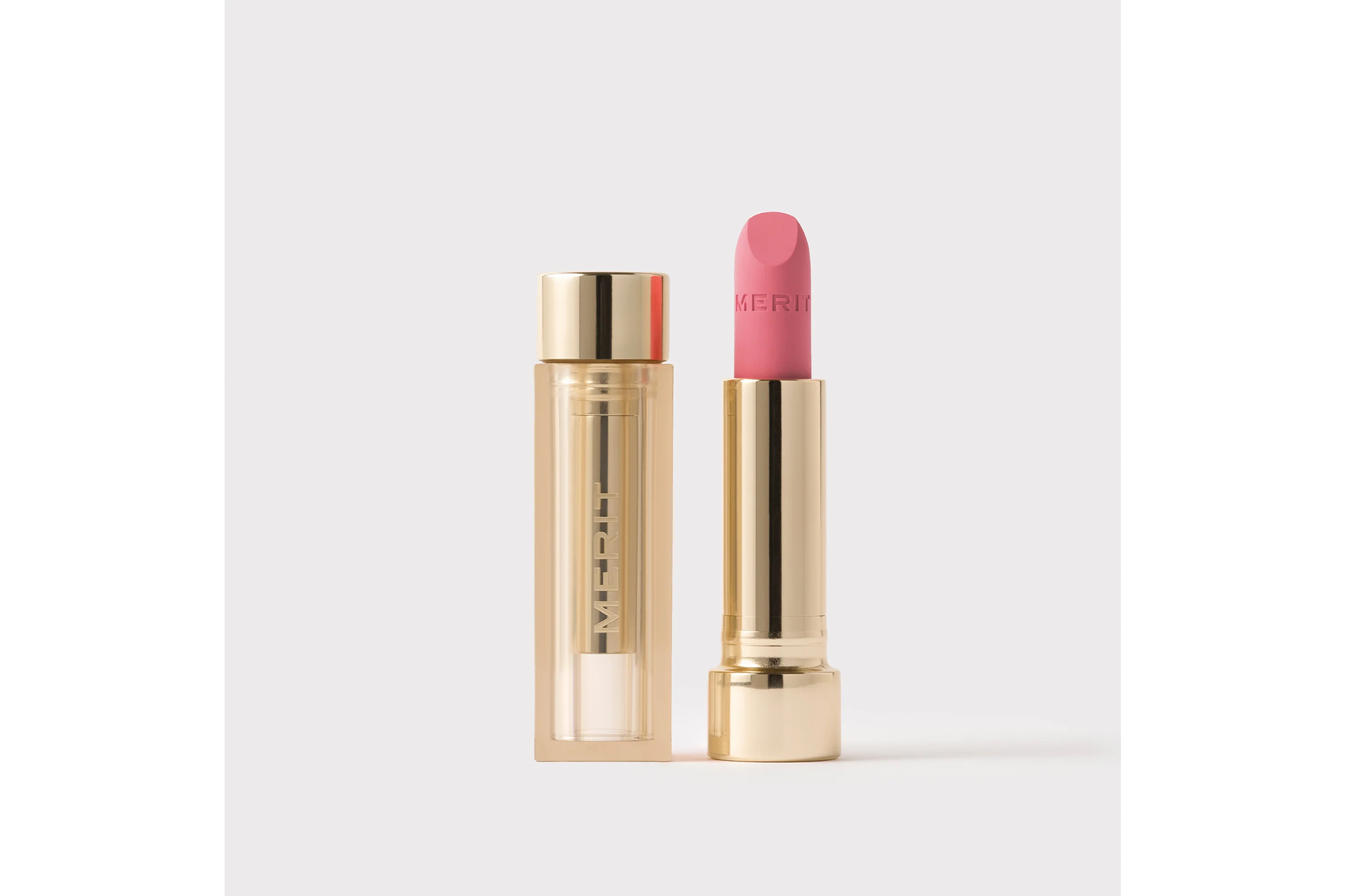 Merit Lip Blush in "Andie" with the cap off, showing the lipstick.